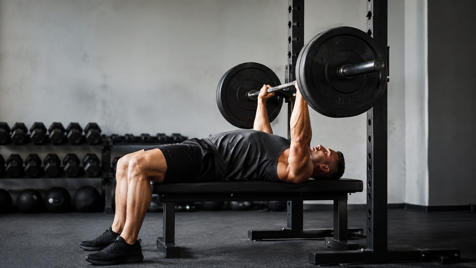 Athlete performing powerful barbell repetitions with stable form and moderate training load