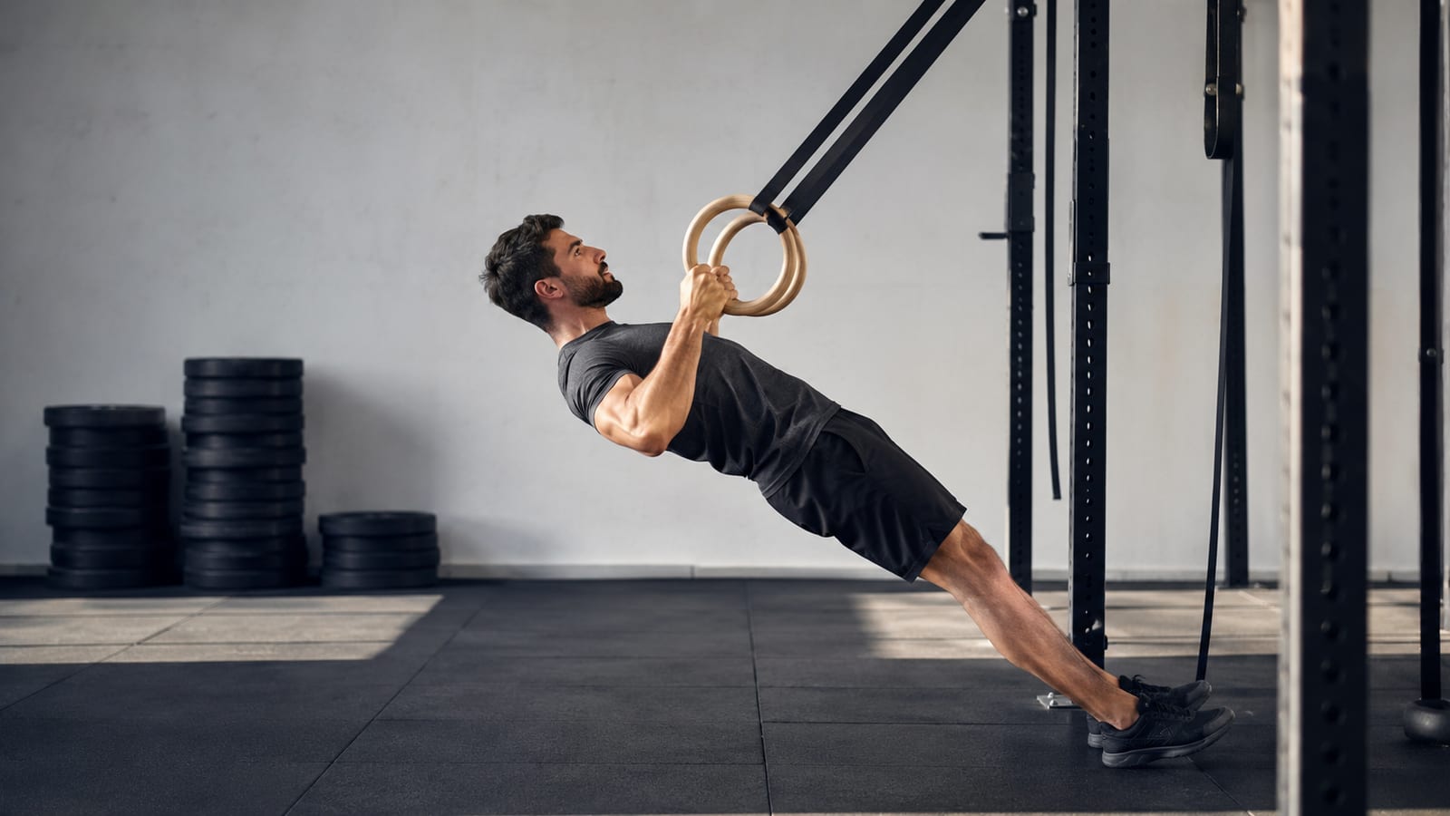 Athlete maintaining careful shoulder alignment during a slow bodyweight movement