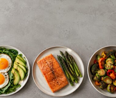 Colorful ketogenic meal with eggs, salmon, avocado, leafy greens, and roasted vegetables